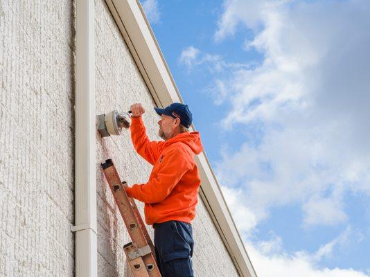 Centec Technician working on Video Surveillance Camera