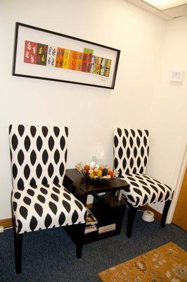 Whole Psychotherapy's cozy waiting room offers confidentiality, privacy, and features a plentiful snack and beverage selection.