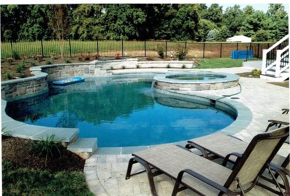 Pool spa combo with paver decking