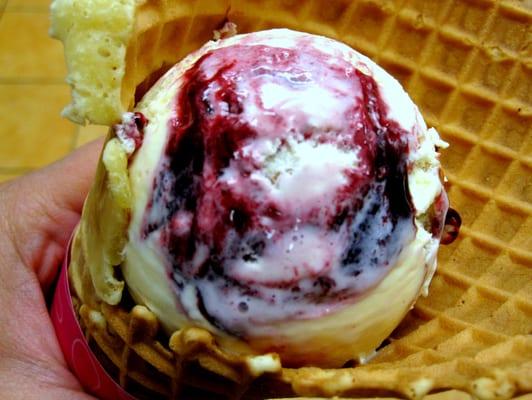 Baseball Nut (Vanilla ice cream and cashews with a black raspberry ribbon) in a waffle cone