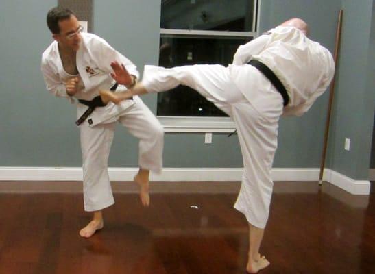 Mawashi geri (round-house kick) and block