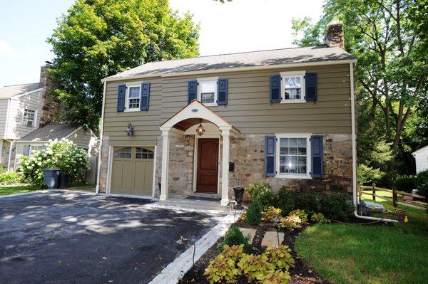 New portico, siding, shutters, windows and doors.