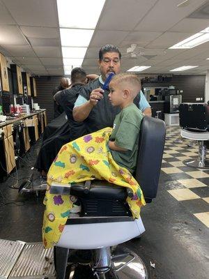 This is the barber who shaved my son's eyebrow the weekend before picture day. Not saying a word about it.