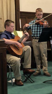 Sibling students at Wild Roots recital