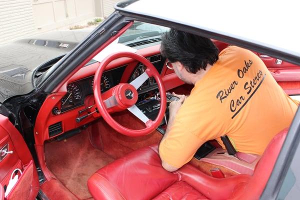 Angelo working on an old corvette