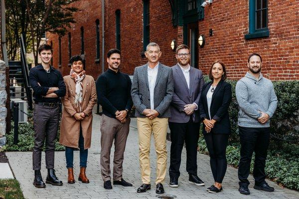 The Chuck Honabach Team posing for a photo in front of our office.