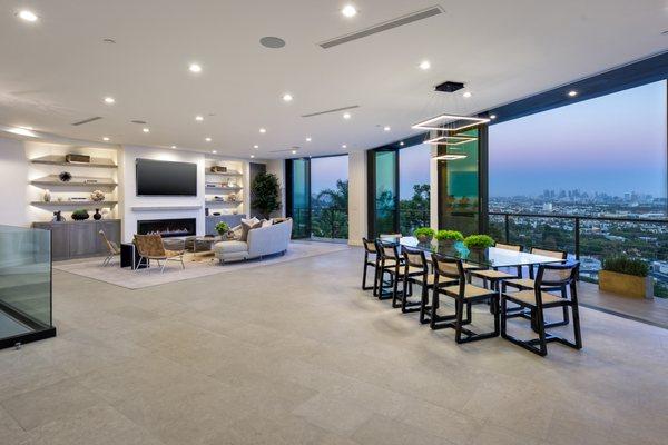 New contemporary home located in the Hollywood Hills with panoramic views over Los Angeles accentuated by walls of glass.