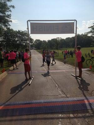 My friend's first 5K, crossing the finish line, yay!!