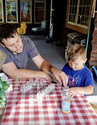 Enjoying a game of chess on the front porch