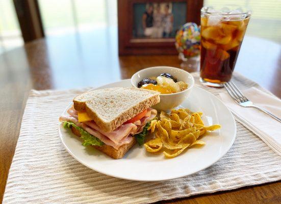 Ham & Cheese on Light Wheat, Fruit Compote, and Fritos