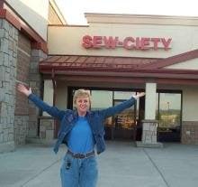 Carol in front of Sew-ciety in Castle Rock, Colorado