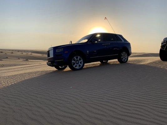 Filming the Roles Royce Cullinan in the sand dunes