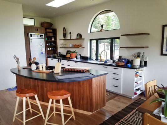 Walnut and paint-grade cabinets, floating shelves