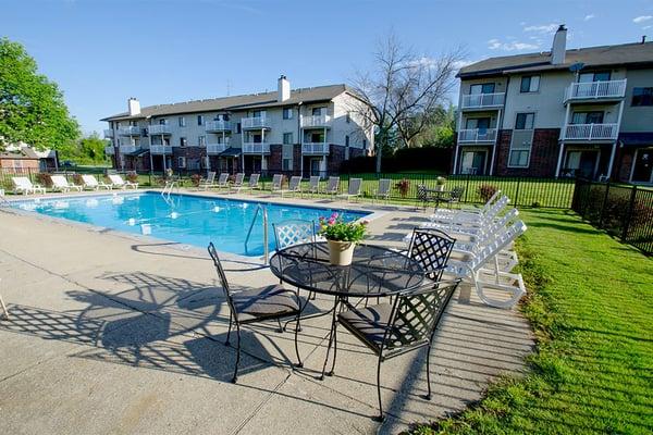 Relaxing pool-side sundeck at Eastland Apartments in Kentwood, MI