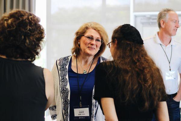 Women Talking at Excellence Performance Seminar