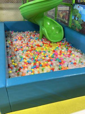 Empty ball pit with dirty mat under