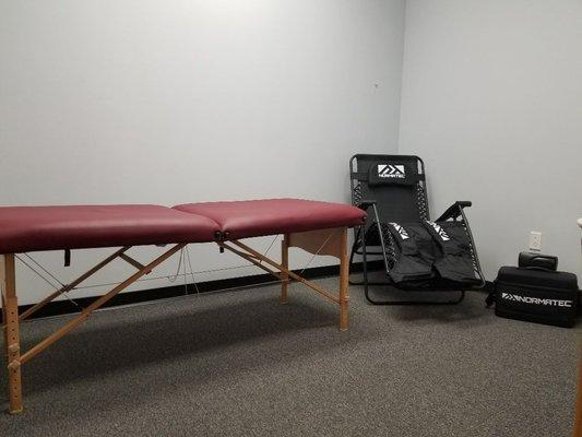 Treatment room with Normatec Recovery Boots to help you with your recovery.