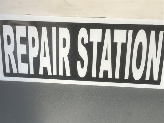 repair station sign below service window