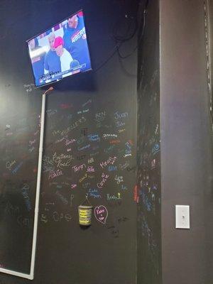 Guests get to sign the chalk wall