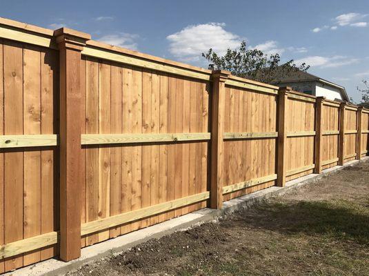 Alphascapes installed this mow strip/retaining wall under a fence we installed.  It turned out great!