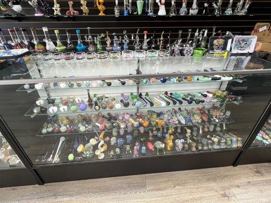 We have a variety of glass bowls and mini waterpipes with crazy designs, or simple as can be!!