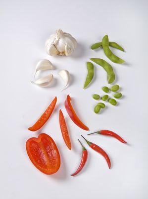 Vegetable Still Life on white tabletop.