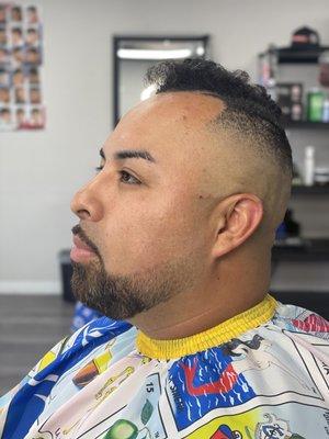 High bald fade with beard line up and fade