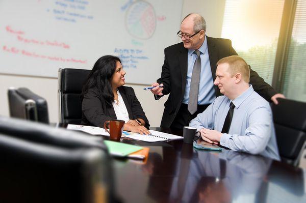 CB Smith & Associate CPAs discuss tax planning in the Alpharetta conference room.