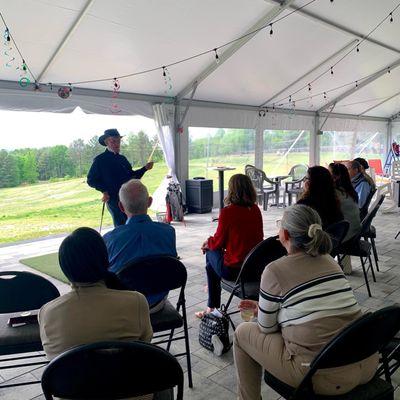 Bob Fahy hosting a clinic from inside our tent space on the driving range!