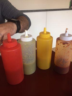 New sauces on the right, the clear one is spicy and smokey! The yellow one is the REALLY hot one! Great sauces..