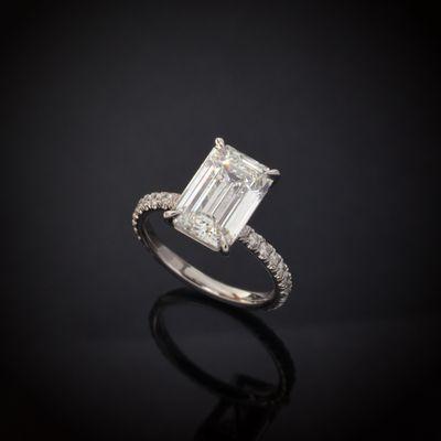 Custom made platinum micro pave' diamond engagement ring with a 3.20 Carat GIA Certified Emerald Cut Natural Diamond