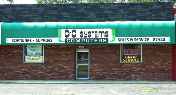 Our distinctive green awning marks the spot where good things happen to your computer.