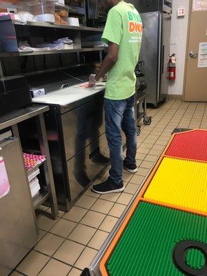 Using his gloves to touch bread and touch the equipment and the food at he same time pisses me off