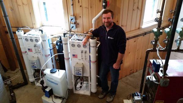 Ellsworth Sales Technician and Master Plumber Rod Chaffee with a whole house reverse osmosis system.