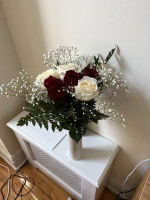 Bouquet of white and red roses, + small decorating leaves/flowers