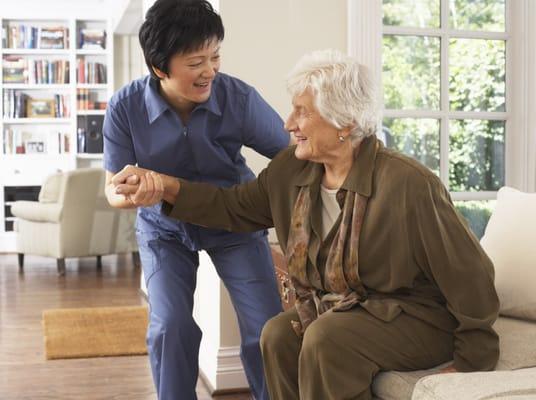 Caregiver helps with walking and personal care