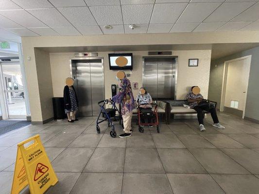 Elevator on the right is not working for the 5th time, blocked by a couch and elderly have been waiting and waiting.