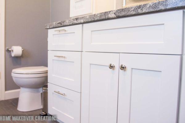 White and gray bathroom remodel in Mesa, Arizona with hexagon tile details.