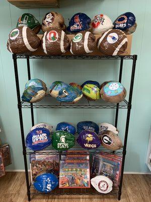 Come to SanCap Pak n Ship to find your favorite sports or college teams painted on a coconut.