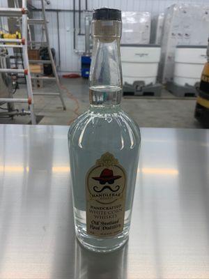 A bottle of corn whiskey in the distillery