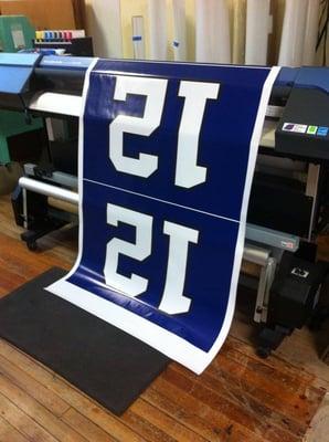 We print large format color banners.  Go Hawks!