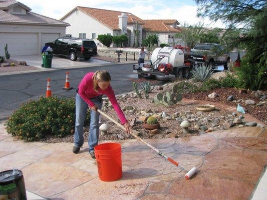 Applying a clear epoxy coating to flagstone patio