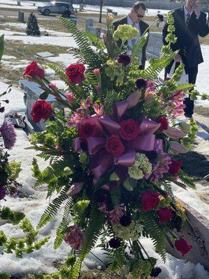 Beautiful standing spray with assortment of pink pale green purple and white blooms