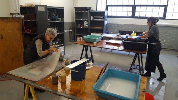 Artists working in the Community Papermaking Studio