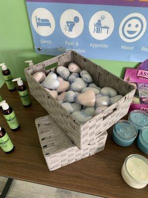 CBD Tea Tree Massage Oil, CBD bath bombs, and aromatherapy candles!