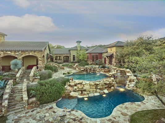 Hill Country pool with rock waterfalls and grotto.