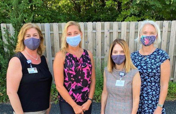 Our CEO Joanne Borduas, State Representative Michelle Cook, our COO Gina Burrows, and State Representative Maria Horn