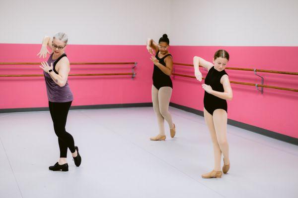 Tap dancers with instructor