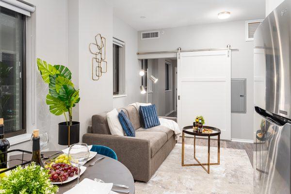 Park Heights Apartments Living Area with Sliding Barn Door