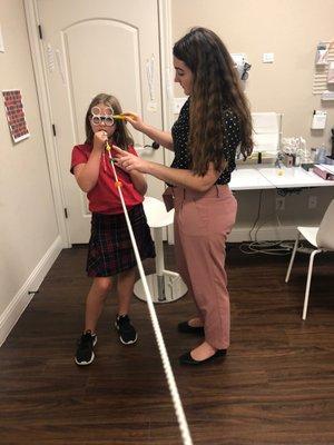 Vision therapist, Silence, working with her patient at the Waco clinic.